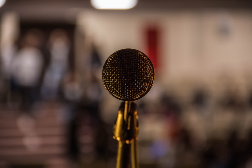 Advocate for yourself, gold standing microphone 