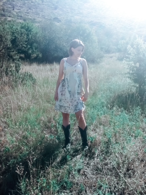 Rheumatoid arthritis story Woman wearing a dress standing in a field