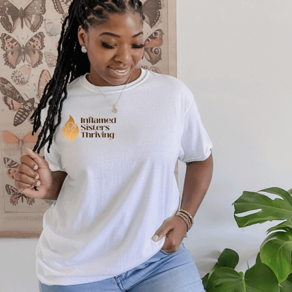 Woman wearing inflamed sisters thriving shirt 