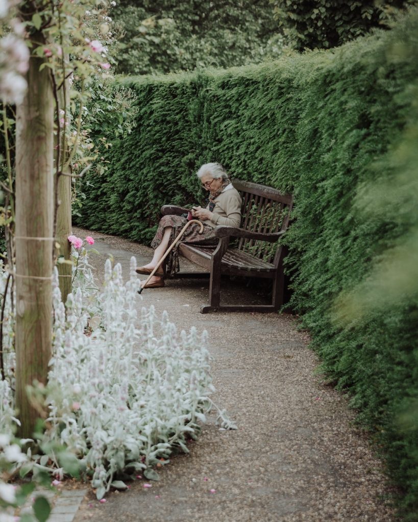 Elderly woman on a park bench 